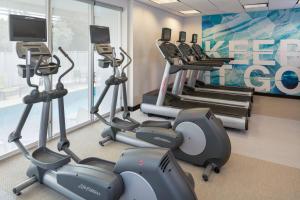 a gym with treadmills and elliptical machines at SpringHill Suites Miami Downtown/Medical Center in Miami