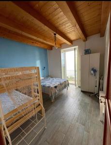 Postel nebo postele na pokoji v ubytování La Perla di Buffari Appartamento Ciappina