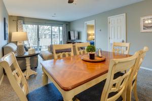 a dining room and living room with a table and chairs at Branson Condo - 3 Mi to Table Rock State Park! in Branson
