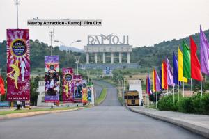 a street with many different flags and a building at Collection O Hotel Happy Stay Near Hyderabad Central in Ameerpet