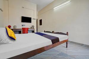 Cama o camas de una habitación en SPOT ON Thomsun Inn