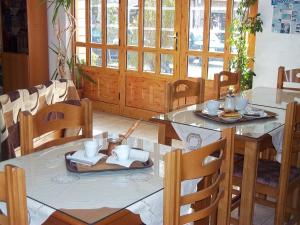 a dining room with a table and chairs at Epikoureios Apollon in Andritsaina