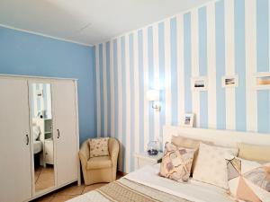 A bed or beds in a room at Superior Apartment le Case del Sole Licata