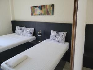 Postel nebo postele na pokoji v ubytování Ceda Guest House by HiveRooms