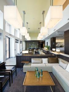 an open living room with couches and tables at Element Vaughan Southwest in Vaughan