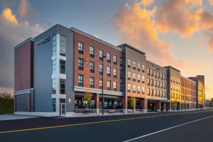 a rendering of a building on a city street at Residence Inn by Marriott Manchester Downtown in Manchester