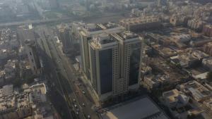 an aerial view of a city with tall buildings at Al Rayyan Towers 1 in Makkah