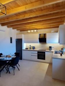 a kitchen and dining room with a table in it at Villa Natural View in Moutsoúna +11 photos