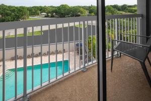 a balcony with a view of a swimming pool at Courtyard Tampa Oldsmar in Oldsmar