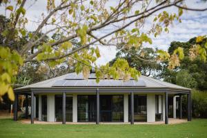 a house with solar panels on the roof at Djilba Cottage at Windance in Yallingup