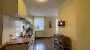 a kitchen with a sink and a counter top at Ferienwohnung Magdalena in Königs Wusterhausen