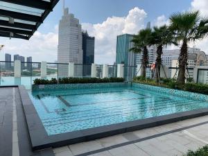 a large swimming pool on top of a building at De Lux Central Studio next Hyatt ,Opera House ,Benthanh ,Pool,Gym in Ho Chi Minh City