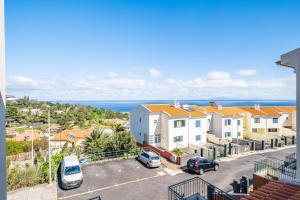 a view of a street with cars parked in a parking lot at Villa Ana D'Arfet in Água de Pena