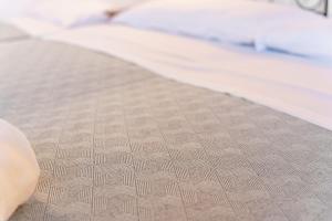 a close up of a mattress on a bed at Casale Ginisara in Castellammare del Golfo