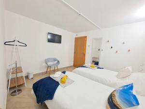 Кровать или кровати в номере Quartos para viajantes, surfistas, grupos, Boa Energia