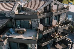 an aerial view of a house with a patio and a table at Opal Executive Suites in Nafplio