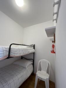 Hôtel Punta e Mare des Chambres ou des Appartements T2客房内的一张或多张床位