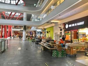 a large shopping mall with a food court in it at G1 Cozy 1-6Pax 3Q bed Sunway Medical Wifi Smart TV in Kampong Penaga