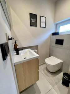 a bathroom with a sink and a toilet at Studio 20for2 Nähe Köln in Bergisch Gladbach
