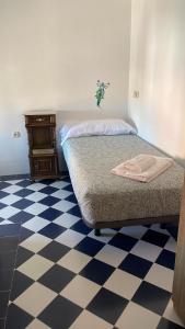 A bed or beds in a room at La canongia