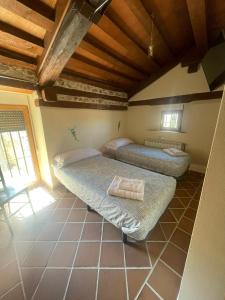 A bed or beds in a room at La canongia