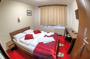 Postel nebo postele na pokoji v ubytování Hotel Konak Konjic