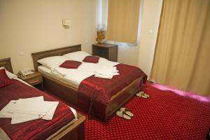 Postel nebo postele na pokoji v ubytování Hotel Konak Konjic
