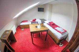Postel nebo postele na pokoji v ubytování Hotel Konak Konjic