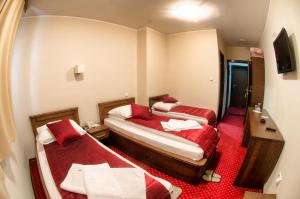 Postel nebo postele na pokoji v ubytování Hotel Konak Konjic