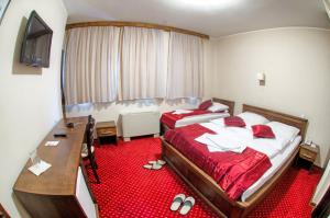 Postel nebo postele na pokoji v ubytování Hotel Konak Konjic