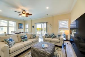 a living room with couches and a butterfly on the ceiling at Pet-Friendly Emerald Isle Vacation Rental! in Emerald Isle