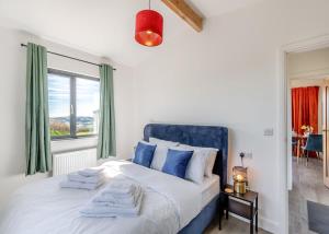 a bedroom with a large bed and a window at Belan View Lodges in Welshpool