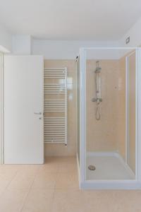 a bathroom with a shower with a glass door at Appartamenti Ceccherini in Malcesine +44 photos