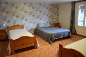 Postel nebo postele na pokoji v ubytování La Sente des Vignes