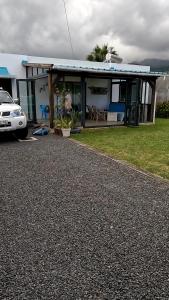 a house with a car parked in front of it at Cozy house for Kite & windsurfers (Le Morne) in Le Morne