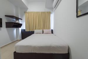 Postel nebo postele na pokoji v ubytování Hollitel Hotel