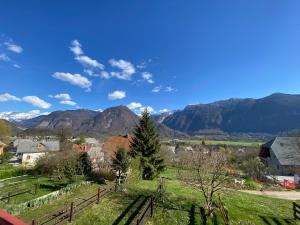 a small village with mountains in the background at Apartment Vita in Bovec