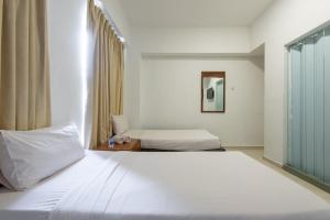 Postel nebo postele na pokoji v ubytování Hollitel Hotel