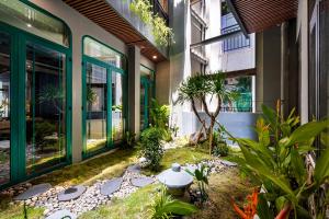 ホーチミン・シティにあるKunKin Garden Aparthotelの建物中庭
