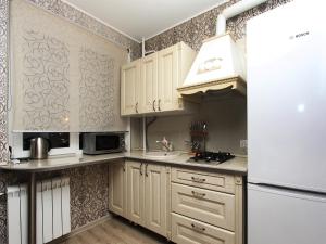 Kuchyň nebo kuchyňský kout v ubytování ApartLux 1905 goda Suite