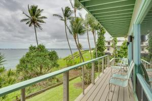 a balcony with chairs looking out at the ocean at Hilo Home with Private Deck and Stunning Ocean Views! in Hilo