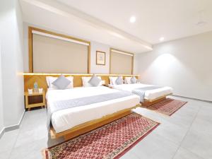 HOTEL OM客房内的一张或多张床位