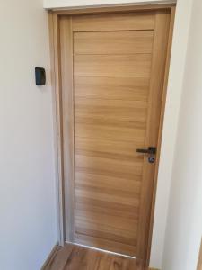 a wooden door in a hallway at Lion Stay in Tartu