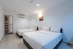Postel nebo postele na pokoji v ubytování Hollitel Hotel