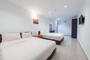 Postel nebo postele na pokoji v ubytování Hollitel Hotel