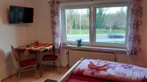 Ein Bett oder Betten in einem Zimmer der Unterkunft Pension "Am Schloß"