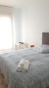 Postel nebo postele na pokoji v ubytování APARTAMENTO TURÍSTICO CARBONERAS