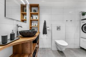 a bathroom with a sink and a toilet at SKI INN/OUT - 4-room apartment w/3 bedroom in Gaustablikk +33 photos