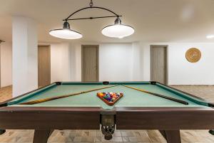 a pool table in a room with cue balls at Villa Luxury Paula's Dream Private Pool Corralejo By Holidays Home in Corralejo