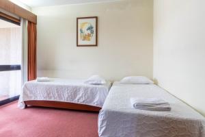 Postel nebo postele na pokoji v ubytování Hotel A.S. Sao Joao da Madeira